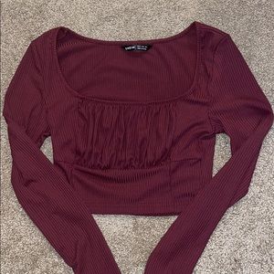 maroon cropped long sleeved top